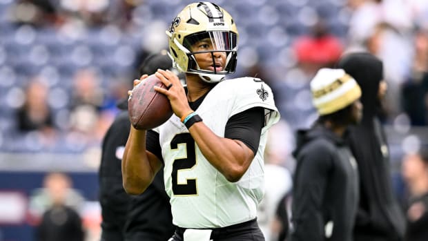 Saints quarterback Jameis Winston prepares to throw a pass in warmups before a game.